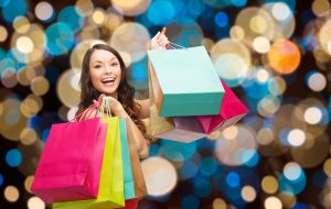 happy woman with colorful shopping bags